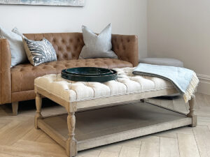 Astrid Deep Buttoned Coffee Table with Wooden Base in Linen